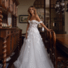 Off-shoulder neckline with delicate draped sleeves