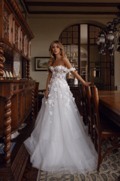Off-shoulder neckline with delicate draped sleeves