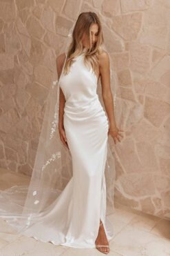 silk halter-neck wedding gown with open back and high slit