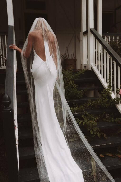 back of silk halter-neck wedding gown with train