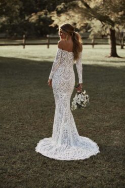 Long sleeve lace wedding dress with off-shoulder neckline and chapel train