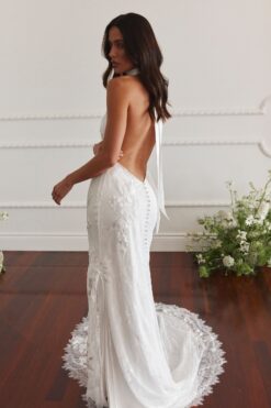 Back view of lace wedding gown with open back