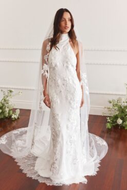 Lace backless wedding dress with chapel train on bride