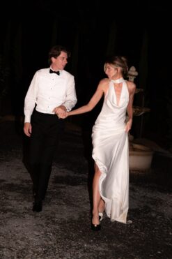 Bride dancing in satin halter backless wedding dress