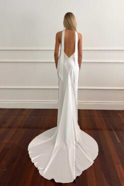 Back view of satin halter wedding gown with open back
