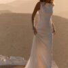 Minimalist backless wedding dress with sweep train at sunset