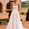 Bride in timeless strapless A-line wedding dress with pockets