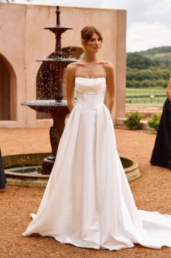 Bride in timeless strapless A-line wedding dress with pockets