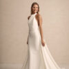Bride in modern high-neck sheath wedding dress with chapel train
