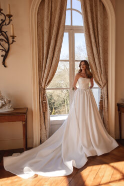 Satin ball gown wedding dress with corset bodice and hidden pockets